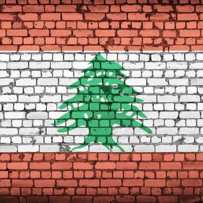 Lebanon flag is painted onto an old brick wall
